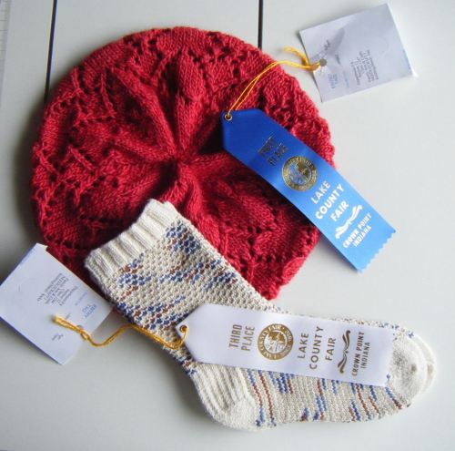 My lace, knit Heart Hat earned a first place ribbon and my Broken Seed Stitch Socks earned third.